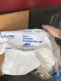 This piece of trash was blowing across the parking lot where I work Has an interesting company achievement printed on it