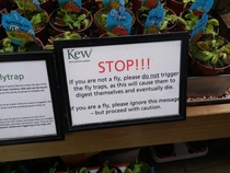 This sign in front of a bunch of Venus Flytrap