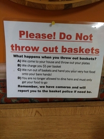 This sign on a trash can