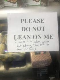 This sign on the deli counter of a sandwich shop
