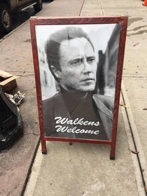This sign outside of a barbershop