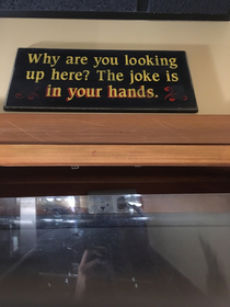 This sign posted above the urinal in the bars bathroom