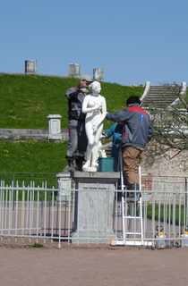 This statue looks like it didnt consent to being cleaned by three strangers