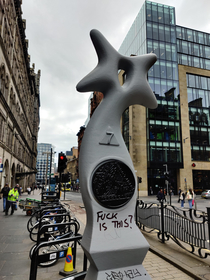 this strange sculpture has popped up in a few places around Glasgow very fitting graffiti