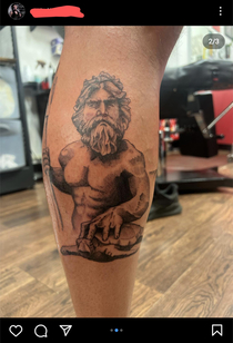 This tattoo artist is just going to pretend that Poseidon ISNT Zach Galifianakis