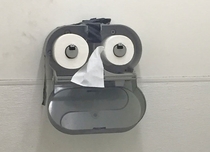 This toilet paper dispenser has seen some shit