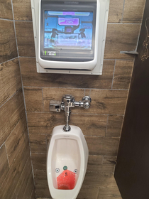 This truck stop attached a video game to the urinals Your steam is the controller