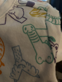 This upside down alligator on my sons onesie