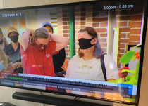 This woman wearing a mask on the local news