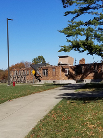 Took a tour of a military training base and saw this building Thought it mustve been another training situation I asked the tour guide and she said Oh yea we accidentally blew it up and them kept walking on as if it was normal