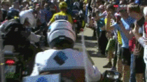 Tour de France leader forced to RUN to the finish after crashing into a motorcycle
