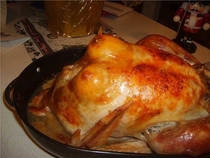 Two lemon halves under the skin before roasting