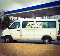Ultra respectable white van selling Girl Scout Cookies Looks inviting and legit