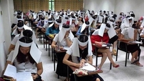 University in Thailand have their students wear anti-cheat helmets while doing their exams