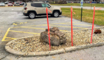 Update Local donut shop put up stakes to keep people from driving over the rock that was meant to keep people from driving over plants