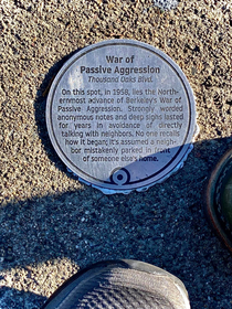 War of Passive Aggression Historical plaque attached to sidewalk Berkeley California