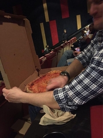 We managed to sneak a large pizza into a movie theater tonight