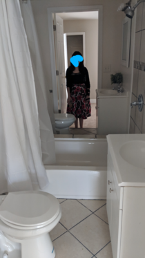 We were looking at houses in Baltimore this weekend and came across this gem There is no mirror in the middle its a completely symmetrical bathroom that  people can use the toilet in at the same time