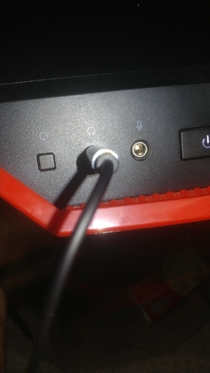 What kind of sick fck puts a button that restarts my computer right next to the headphone jack