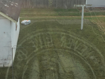When sent this photo me and my Grandma both thought the contractor mowed a message into the grass Its the reflection of my Grandpas shirt in the window