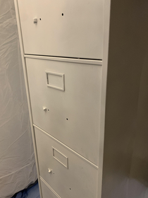 Wife decided to paint the filing cabinet She took all the handles off then closed the doors