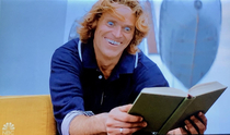 Willem Dafoe reading a book