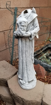Wind knocked over this statue My  year old fixed it