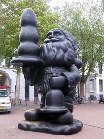 YesThis is a statue of Santa Claus holding a butt-plug