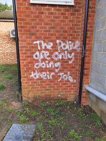 You know you live in a middle class area when the graffiti looks like this
